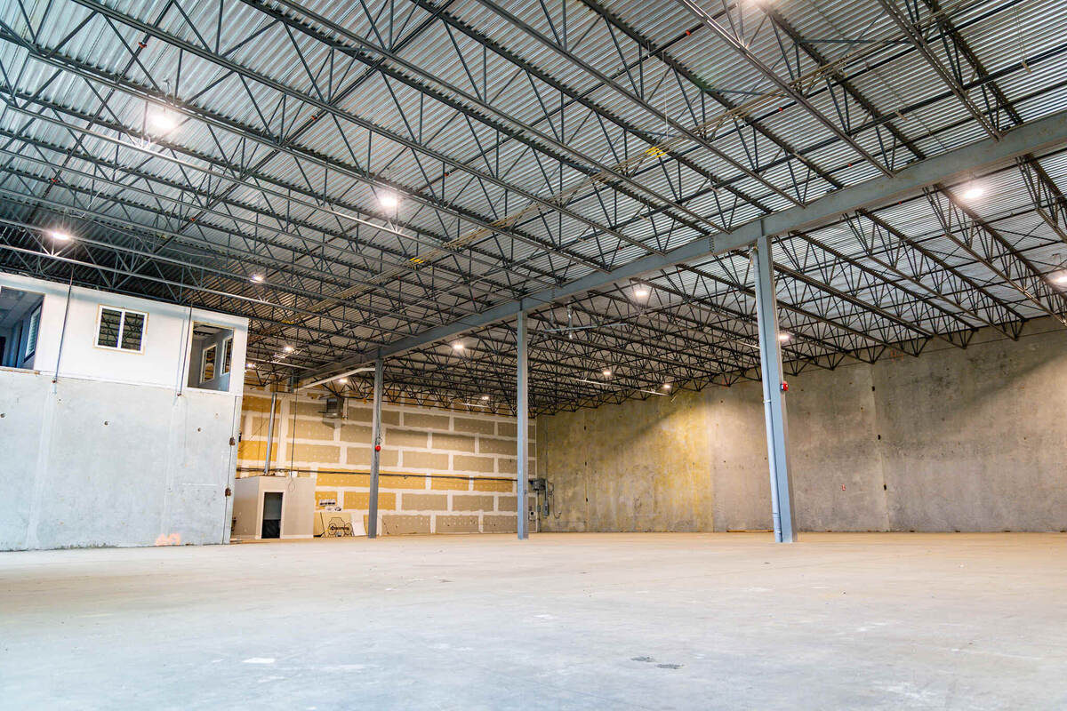Interior of a Metro Vancouver warehouse showing the mezzanine, structural bays and roof structure above