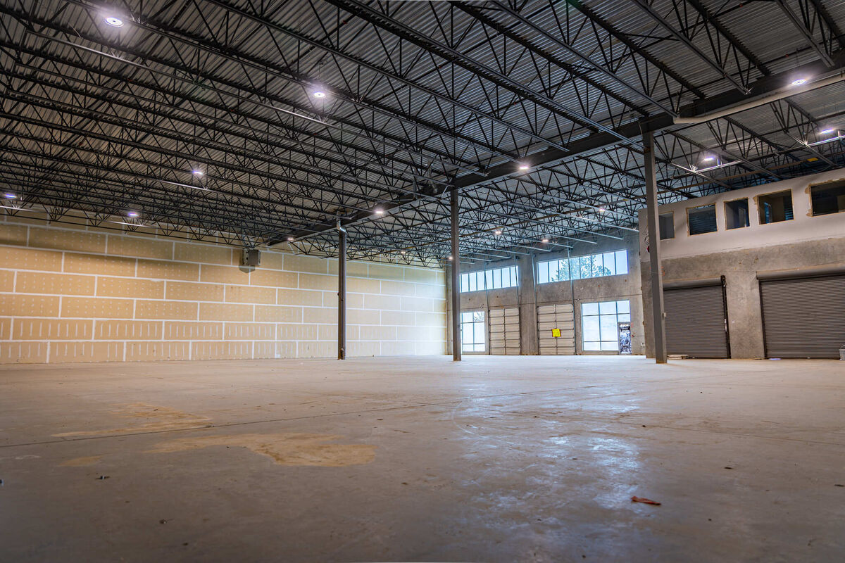 Wide interior view of the main warehouse floor at 8952 Holt Road