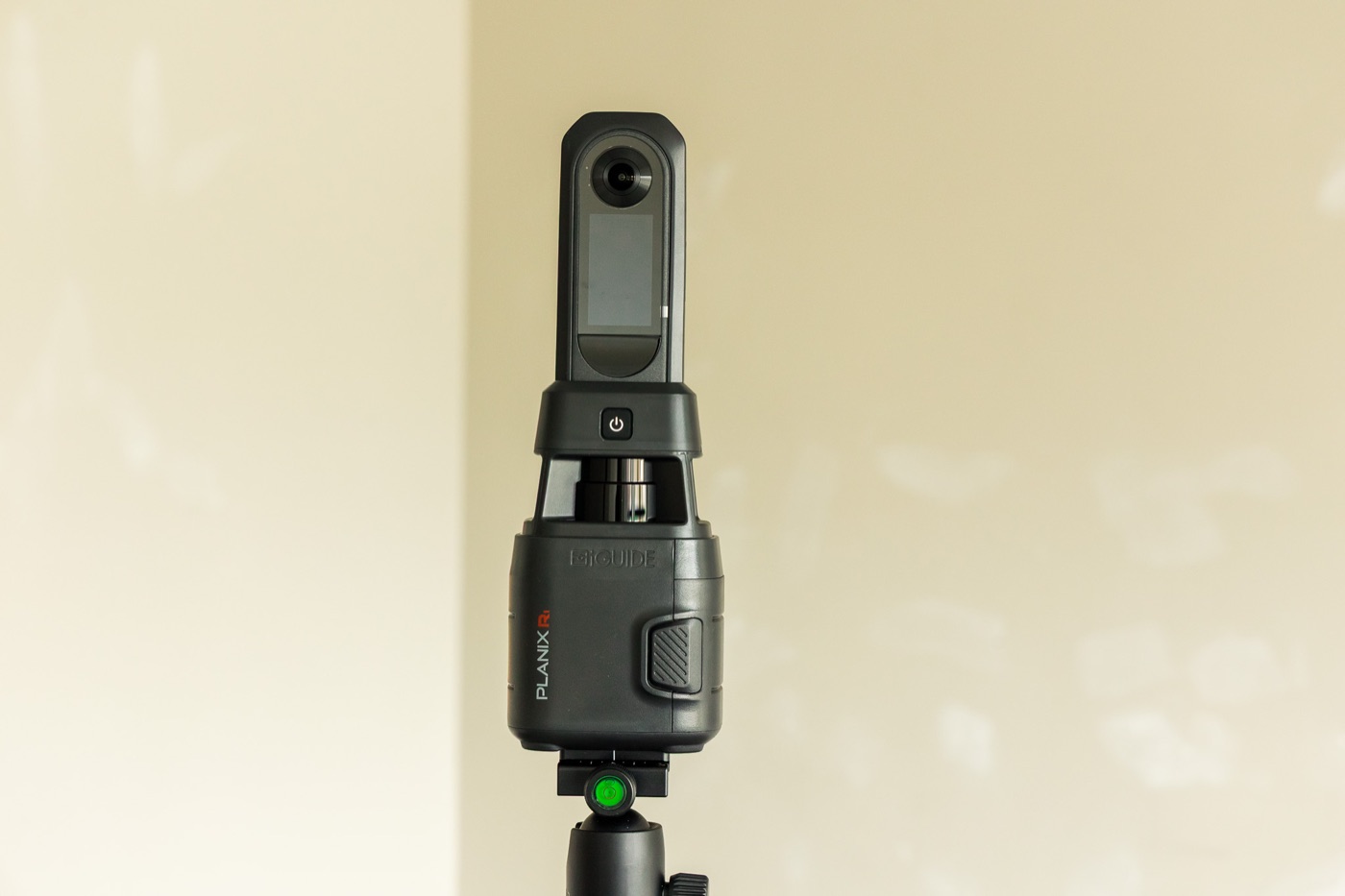 Close-up of the iGUIDE PLANIX LiDAR scanner head on its tripod