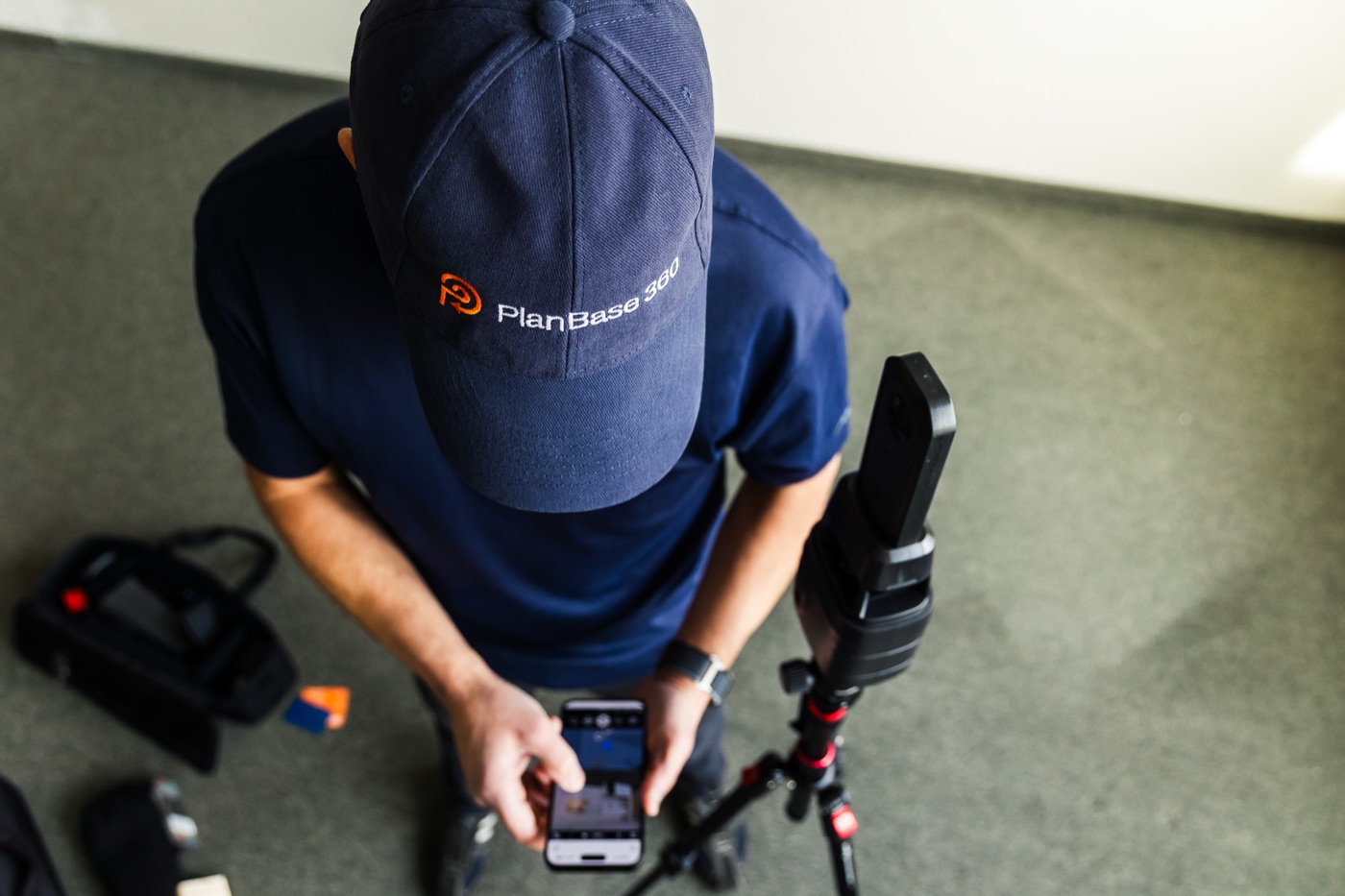 PlanBase 360 operator reviewing captured scan data on a phone before drafting begins