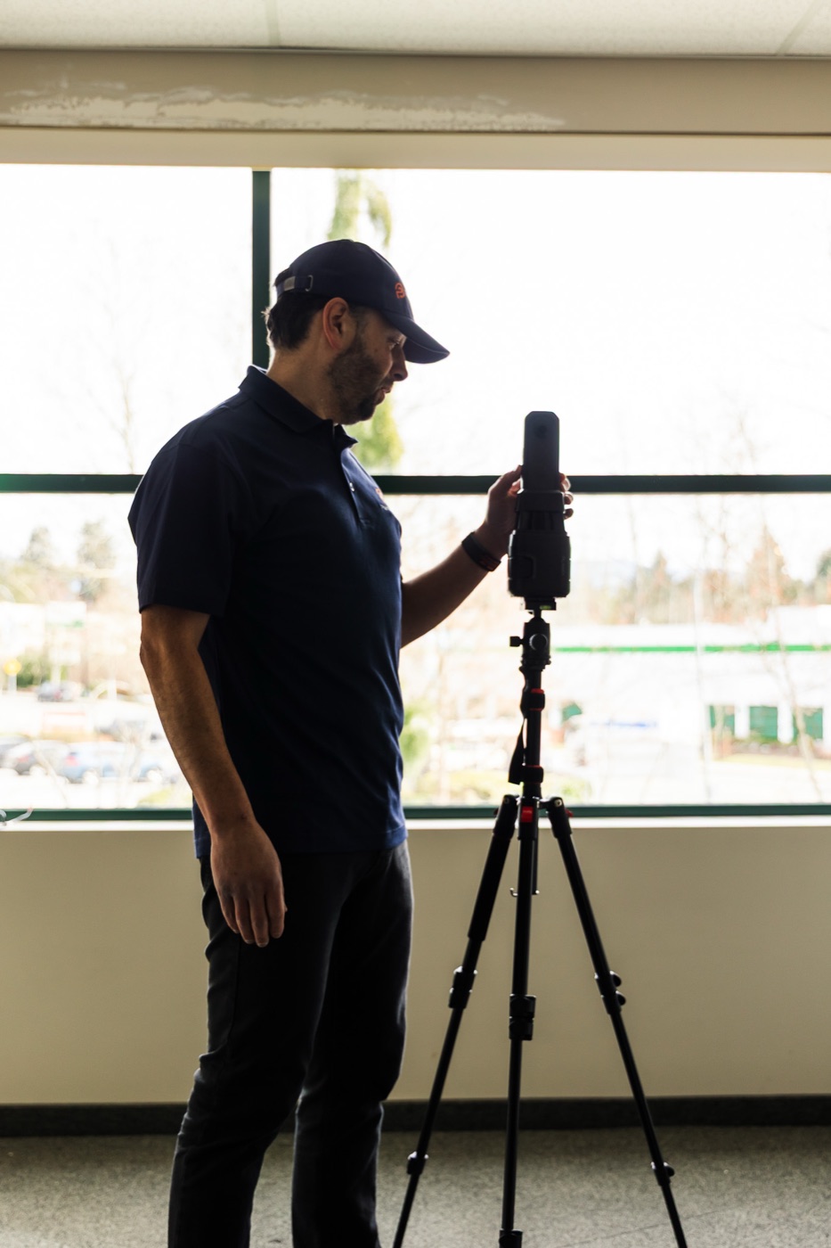 Operator scanning a commercial office interior to produce a measured base set for an architecture firm