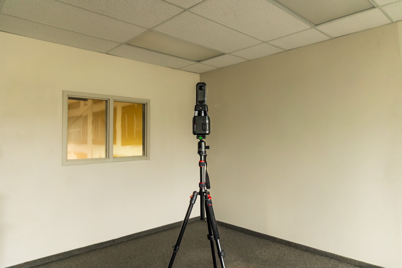 LiDAR scanner set up in a vacant commercial office ahead of a tenant improvement